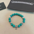 Turquoise Bead Bracelet with Chrome Cross Pendant