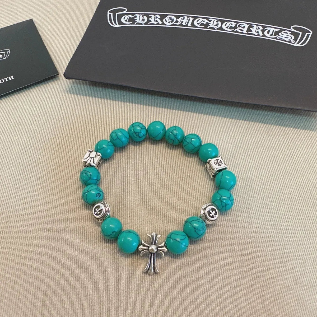 Turquoise Bead Bracelet with Chrome Cross Pendant