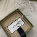 Gucci Silver Interlocking GG Circle Necklace - Modern Elegance