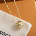 Louis Vuitton Gold Cylinder Diamond Pendant - Elegant Sparkle