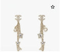 Chanel Gold Star Dangle Earrings - Designer Statement